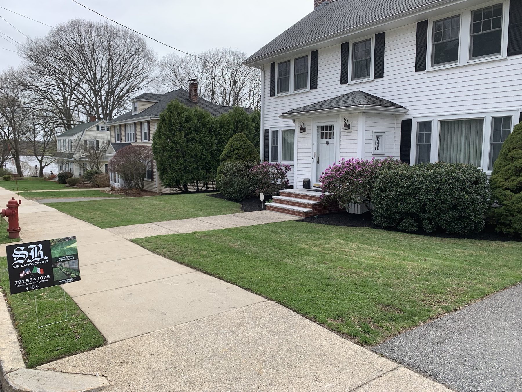 S.B. Landscaping lawn care project in Woburn with branded yard sign